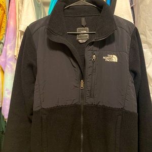 All black north face fleece zip up jacket.